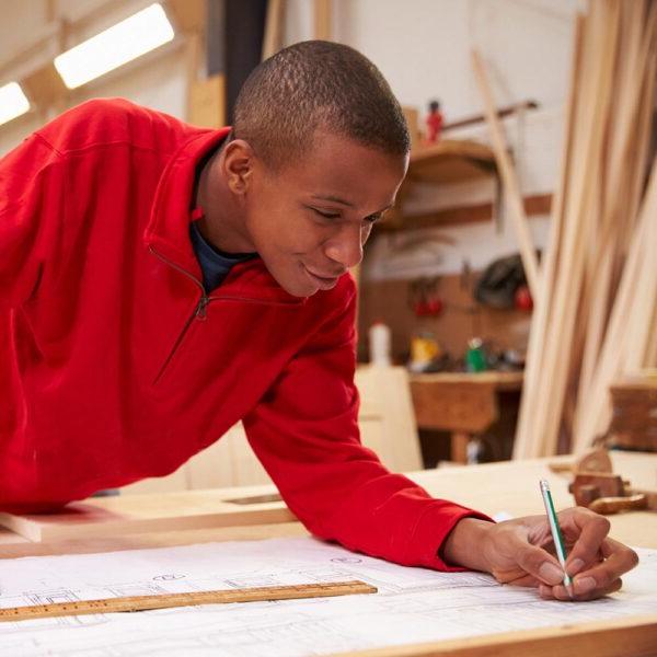 A young black male creating a construction layout