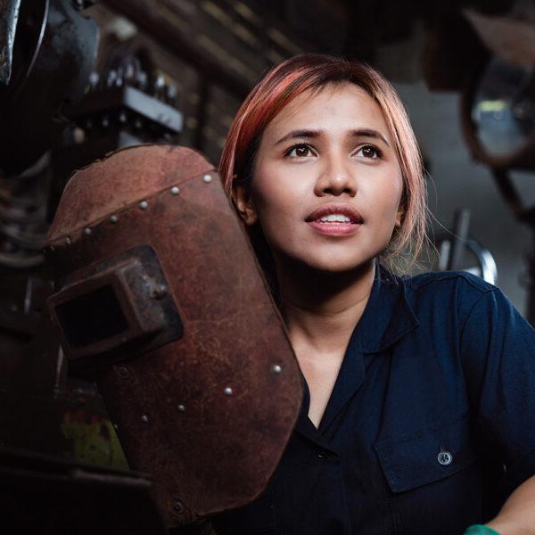 Young woman as a welding apprentice